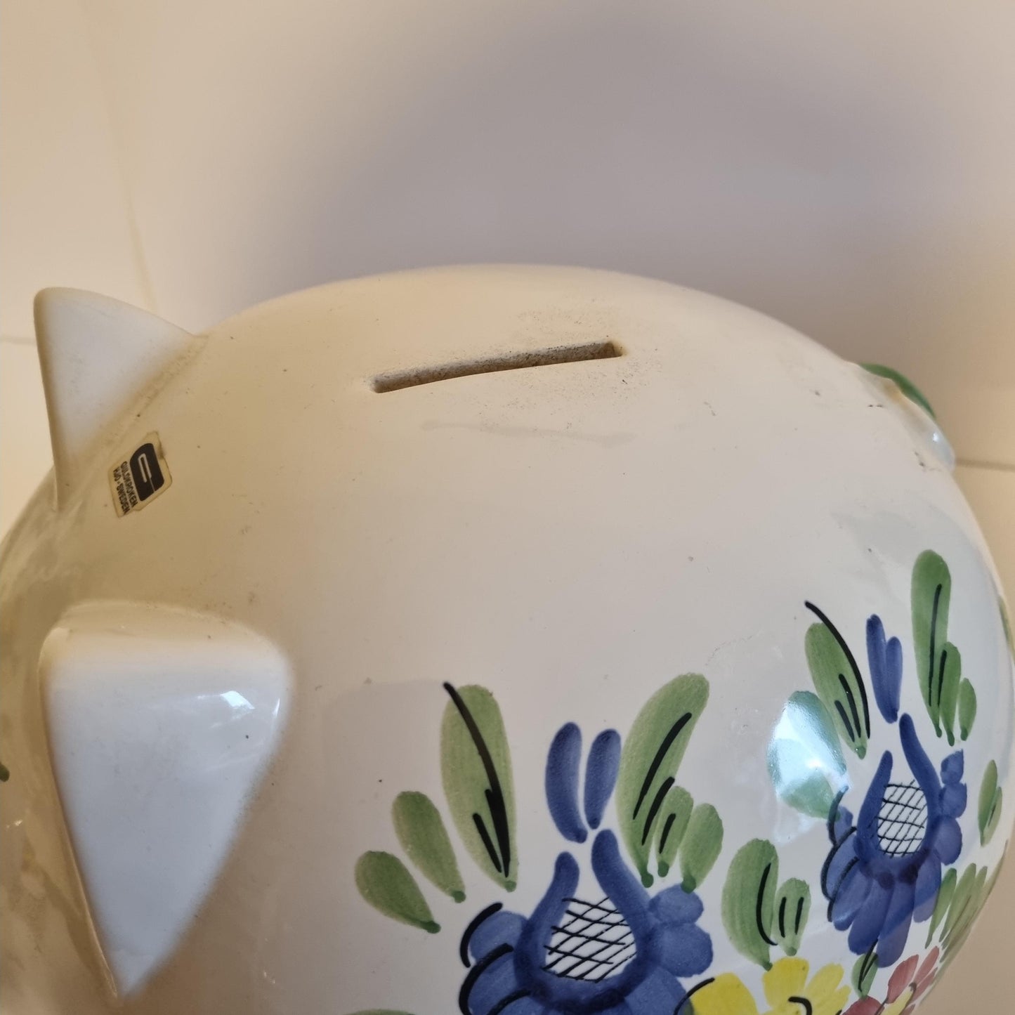 Guldkroken Hjo Swedish Folk Art Ceramic Piggy Bank – 1970s with blue and green floral design on white ceramic