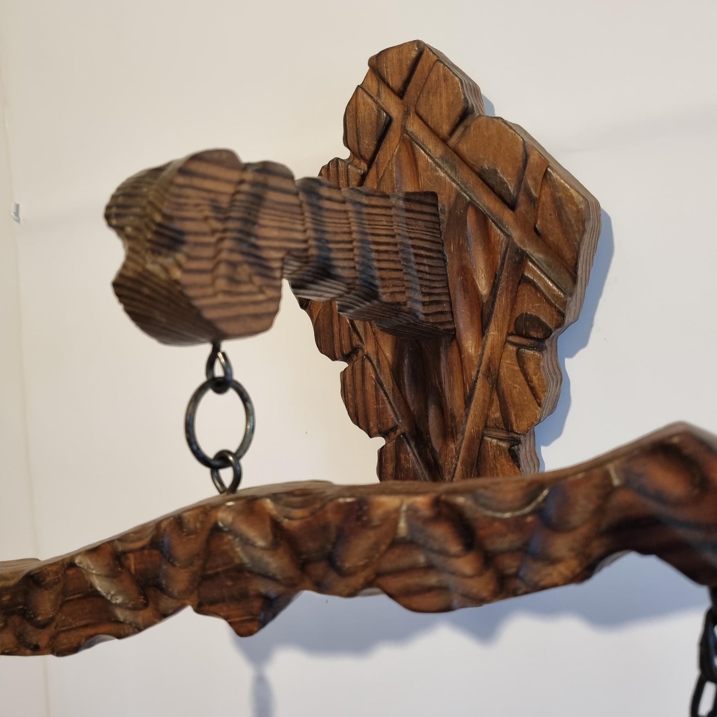 Rustic wooden wall scale candle holder with trays on chains in carved vintage Scandinavian decor style