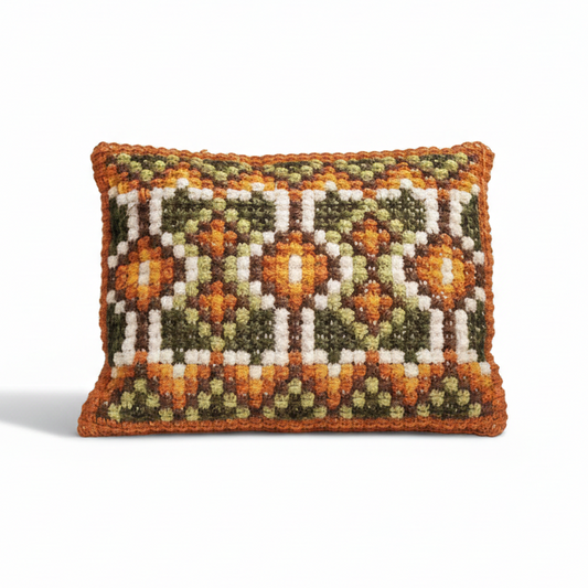 Vintage hand embroidered cushion with geometric pattern.