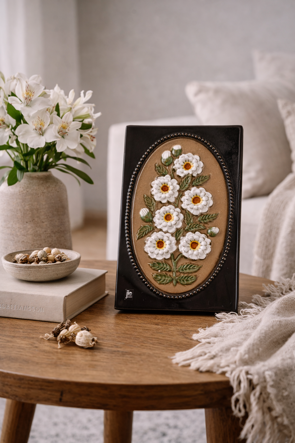 Vintage JIE Gantofta Ceramic Wall Plaque - Aimo Nietosvuori Design with floral relief on wooden table in cozy room setting