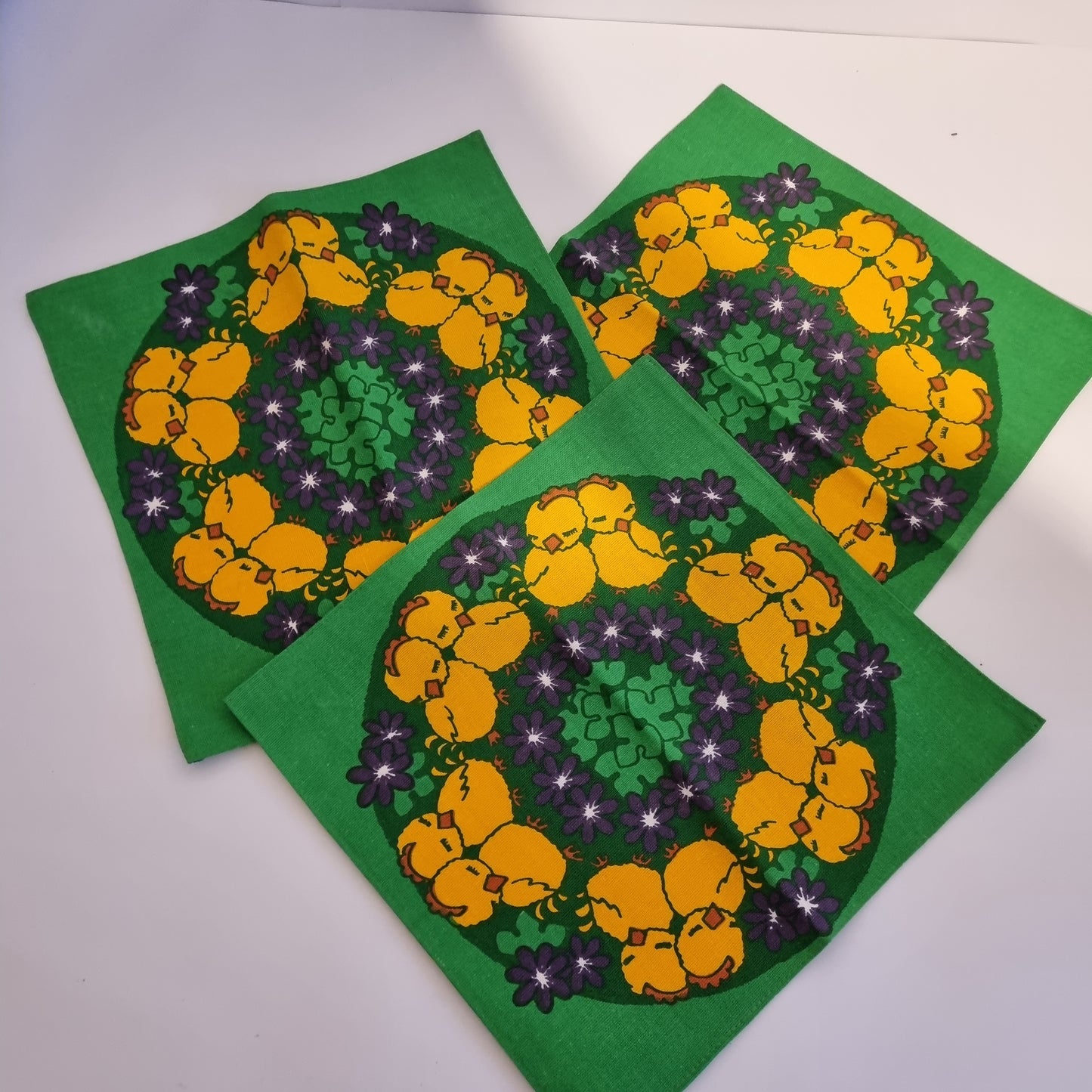Vintage Easter cotton cocktail napkins – set of 3 with yellow chicks and purple flowers on green background, timeless charm.