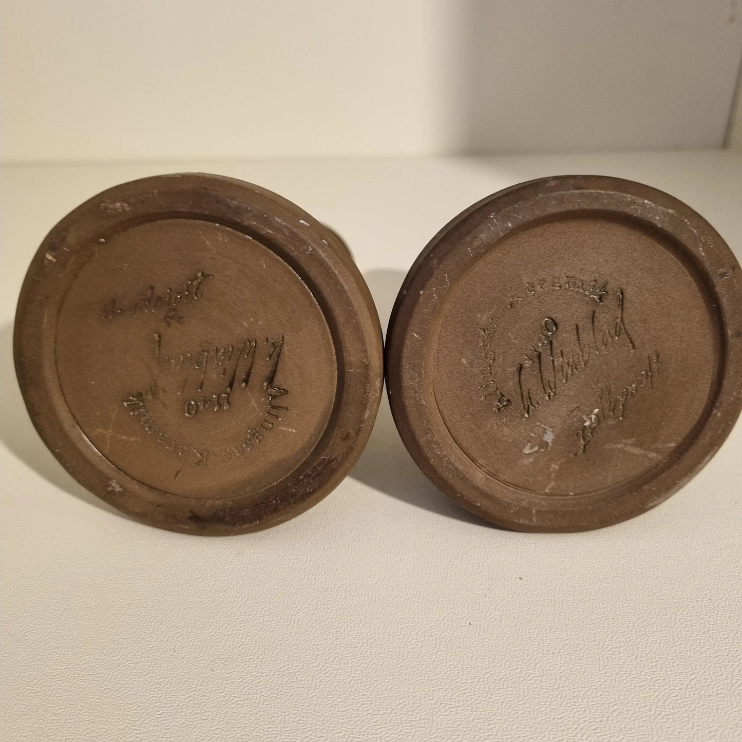 Base view of Vintage Scandinavian Candle Holders – MCM Brutalist Pottery – Retro Ceramic Pair 1960s showing maker’s marks on brown stoneware.