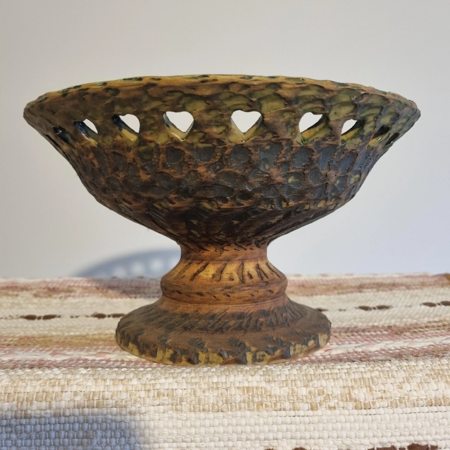 Mid Century Modern Green Ceramic Bowl: Tolla Keramik Heart Cutout Candle Holder with textured surface and heart-shaped cutouts.