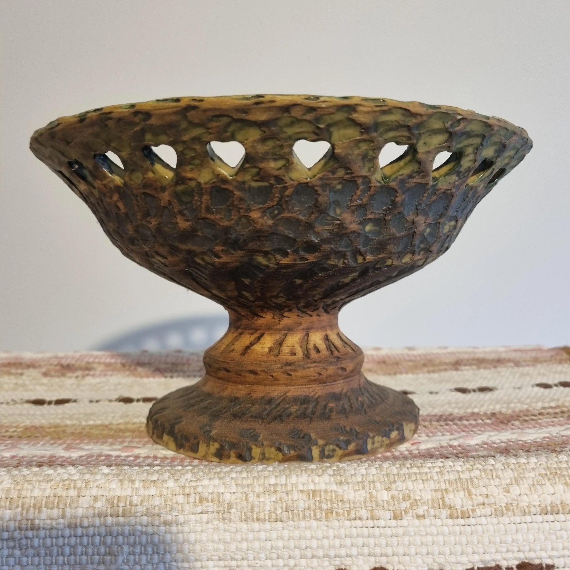 Mid Century Modern Green Ceramic Bowl: Tolla Keramik Heart Cutout Candle Holder with textured surface and heart-shaped cutouts.
