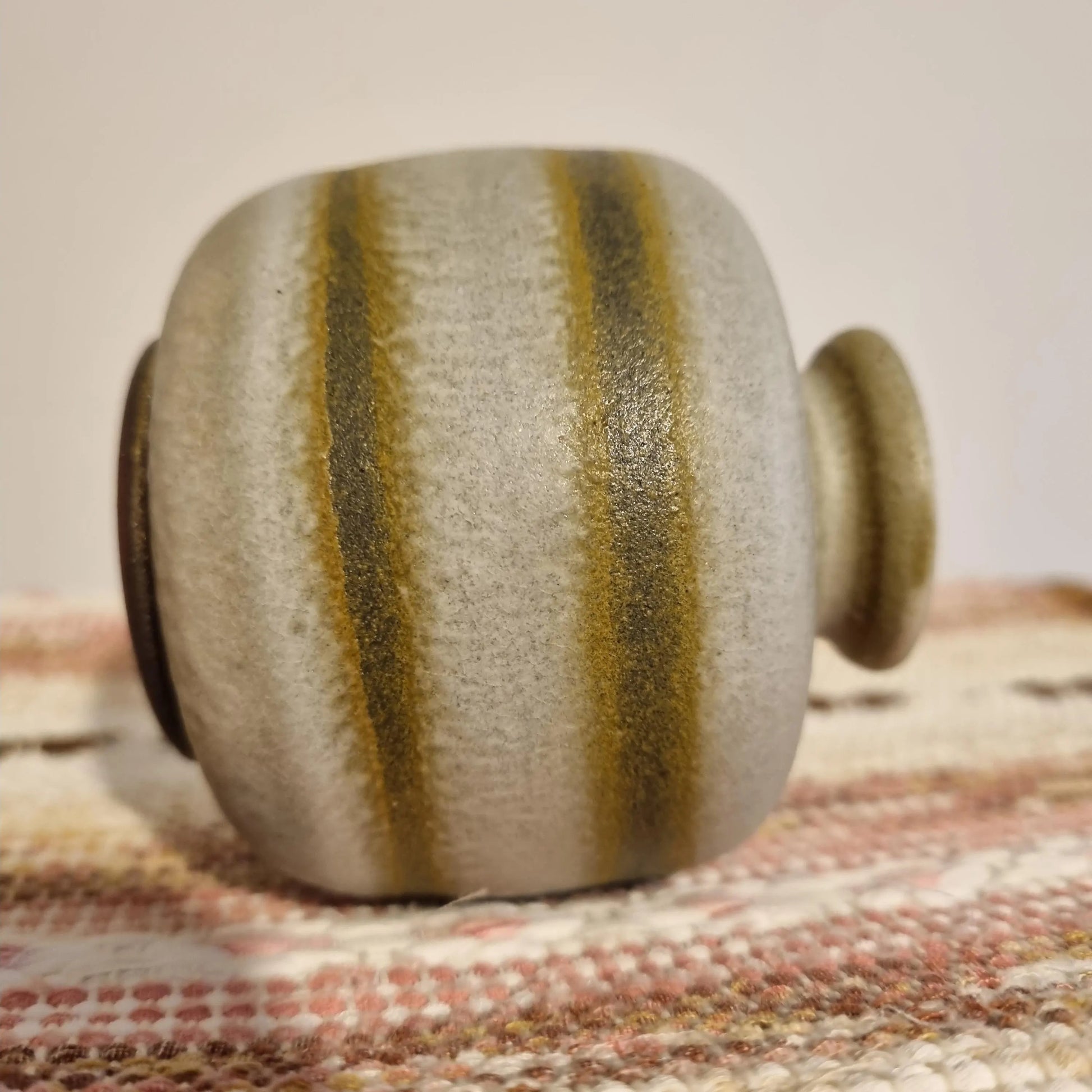 Toreboda Swedish Stoneware Vase – Handcrafted Stengods, Mid-Century with textured stripes on woven textile surface.
