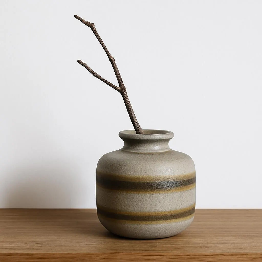 Toreboda Swedish Stoneware Vase – Handcrafted Stengods, Mid-Century with muted stripes and a simple branch on wooden surface.