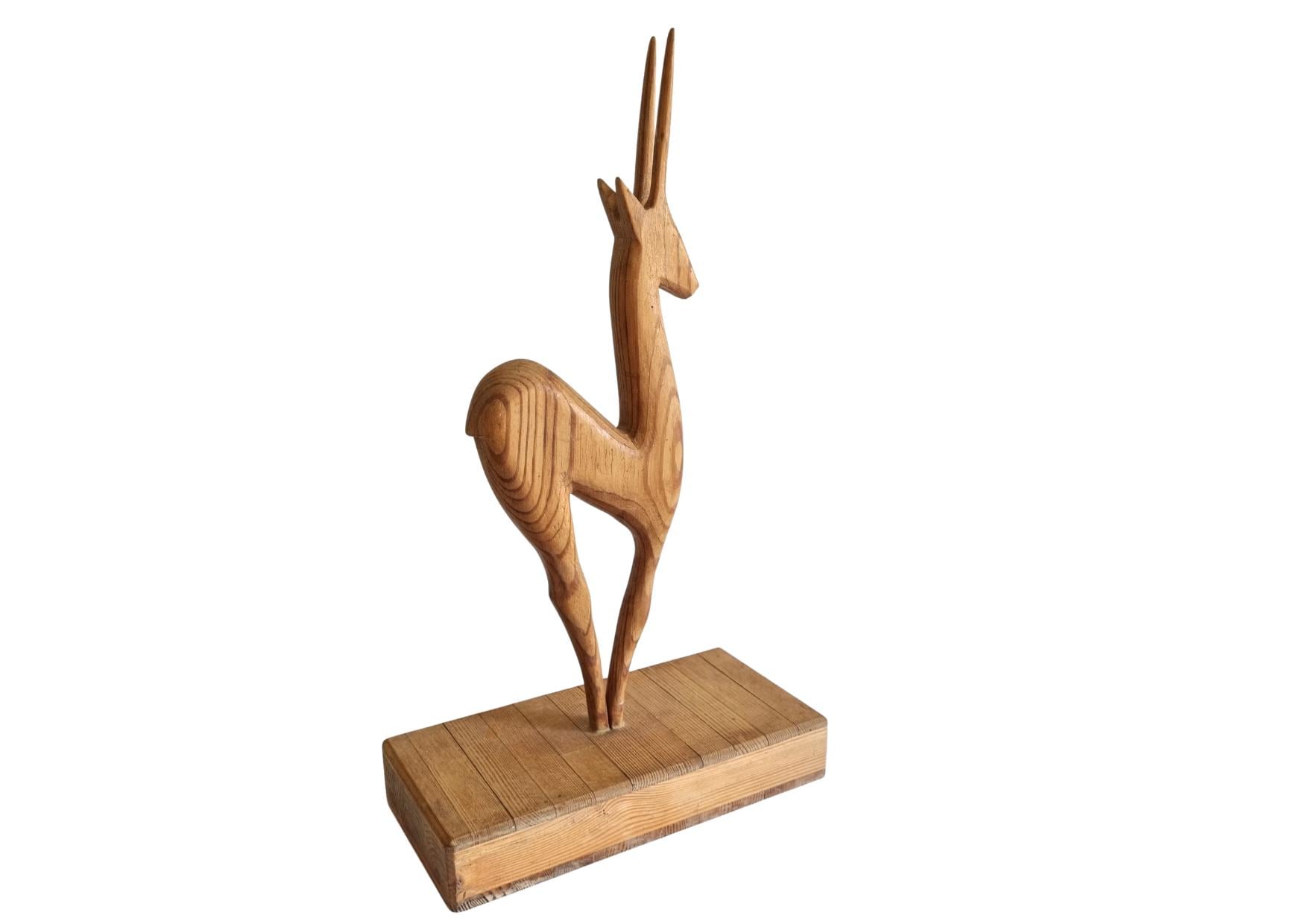Hand Carved Wooden Antelope: Vintage Scandinavian Gazelle Figurine with sleek lines and natural wood finish on a wooden base