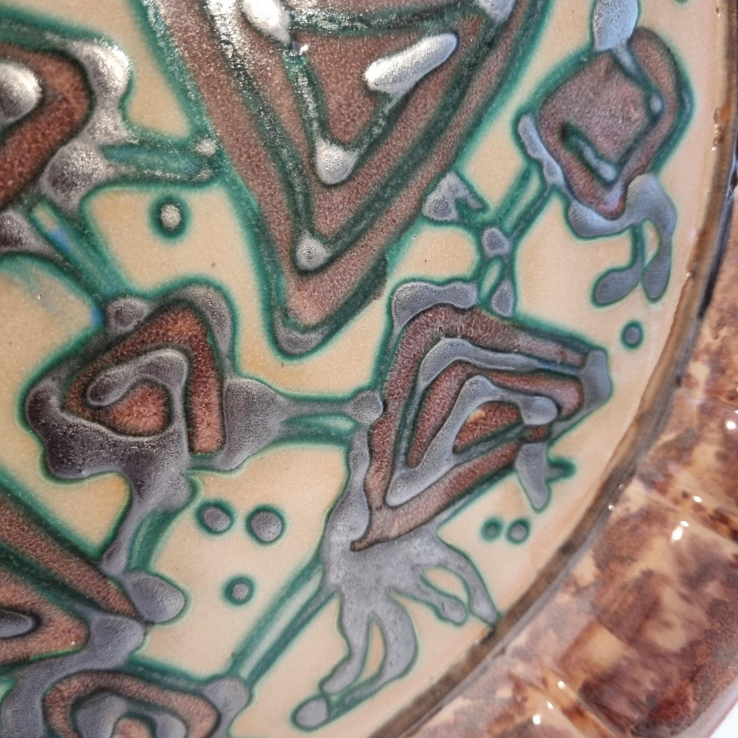 Vintage Swedish Gabriel Keramik Wall Plaque “1936” – Abstract green and brown relief design close-up detail.