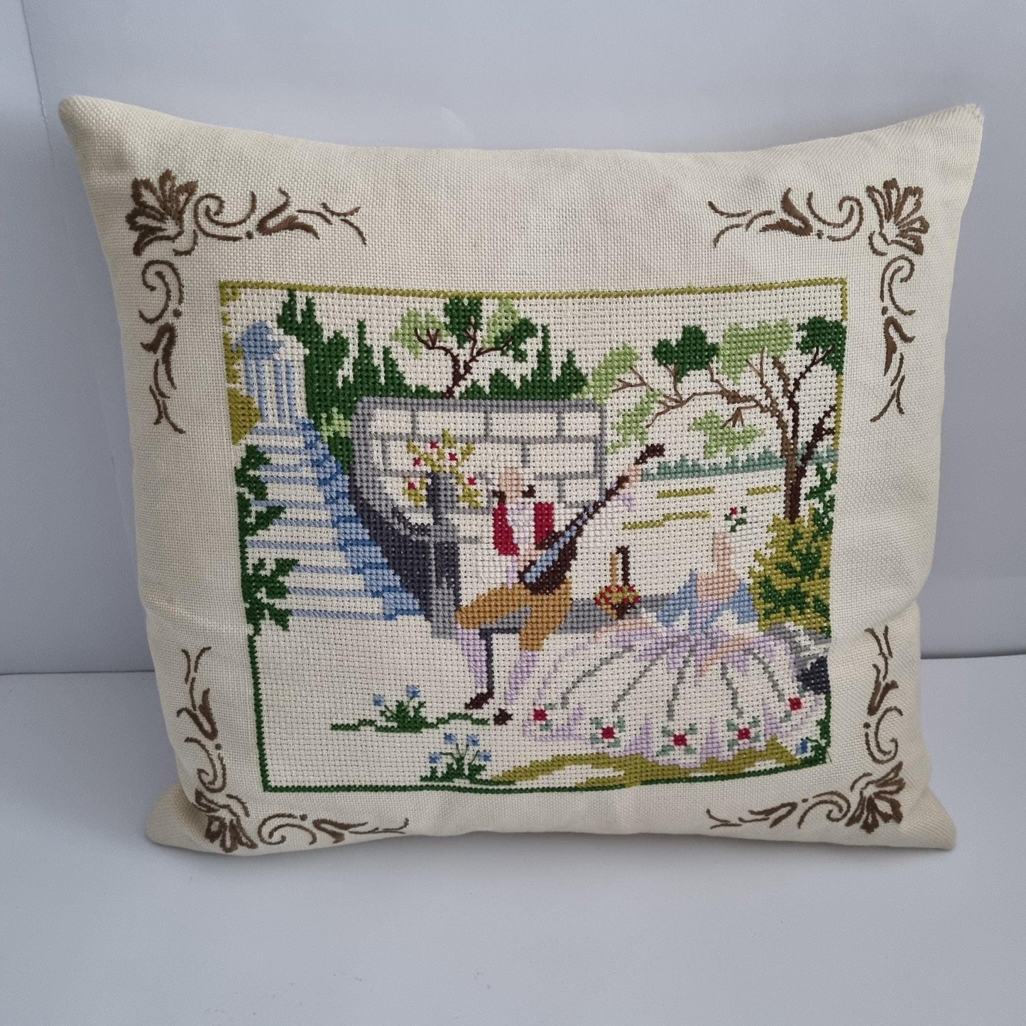 Vintage Hand Embroidered Needlepoint Pillow: Romantic Garden Scene with floral border and outdoor landscape design