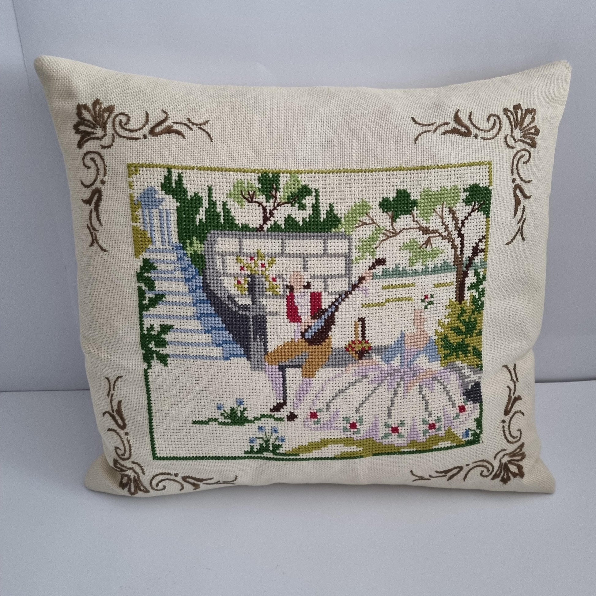 Vintage Hand Embroidered Needlepoint Pillow: Romantic Garden Scene with floral border and outdoor landscape design