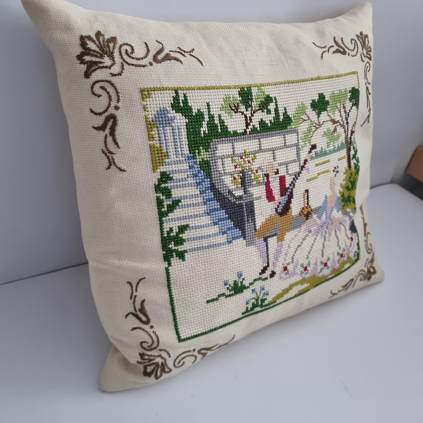 Vintage Hand Embroidered Needlepoint Pillow: Romantic Garden Scene with intricate floral and garden embroidery on cream fabric.