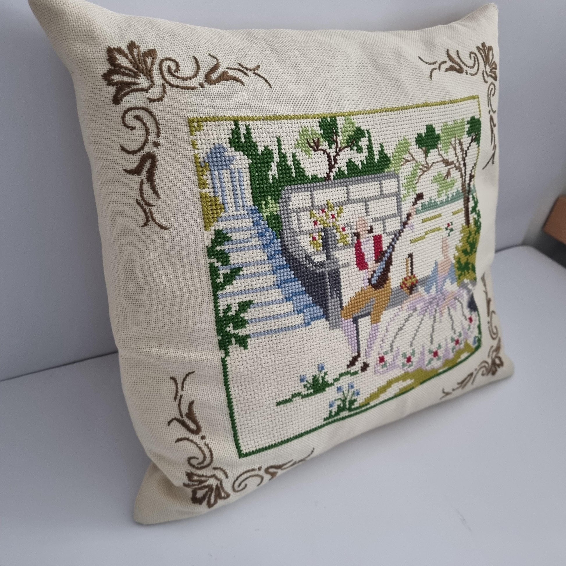 Vintage Hand Embroidered Needlepoint Pillow: Romantic Garden Scene with intricate floral and garden embroidery on cream fabric.