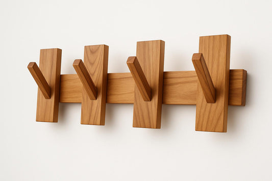 Modular Teak Wall Coat Rack Scandinavian Entryway Organizer with five angled teak hooks on a light wall background