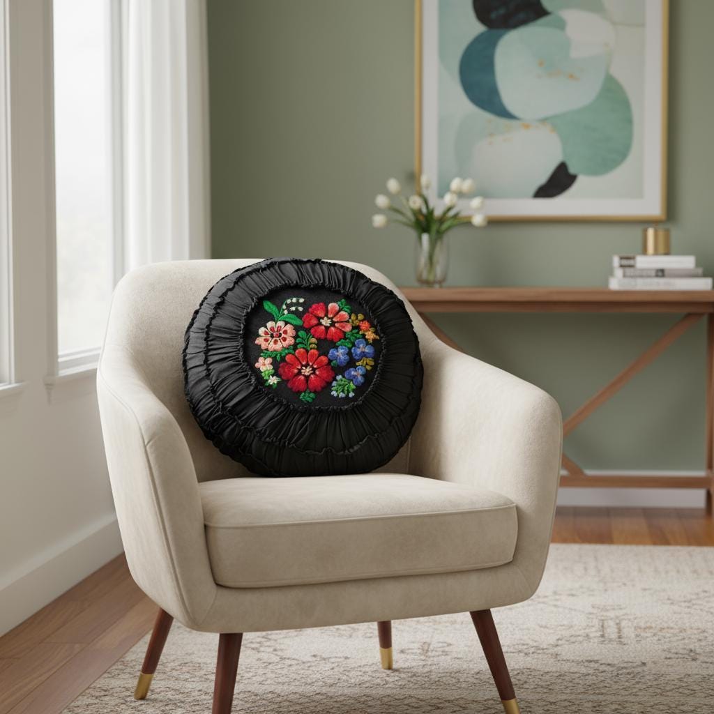 Vintage Embroidered Floral Throw Pillow: Black Ruffled Cushion with colorful flowers on beige modern armchair in living room