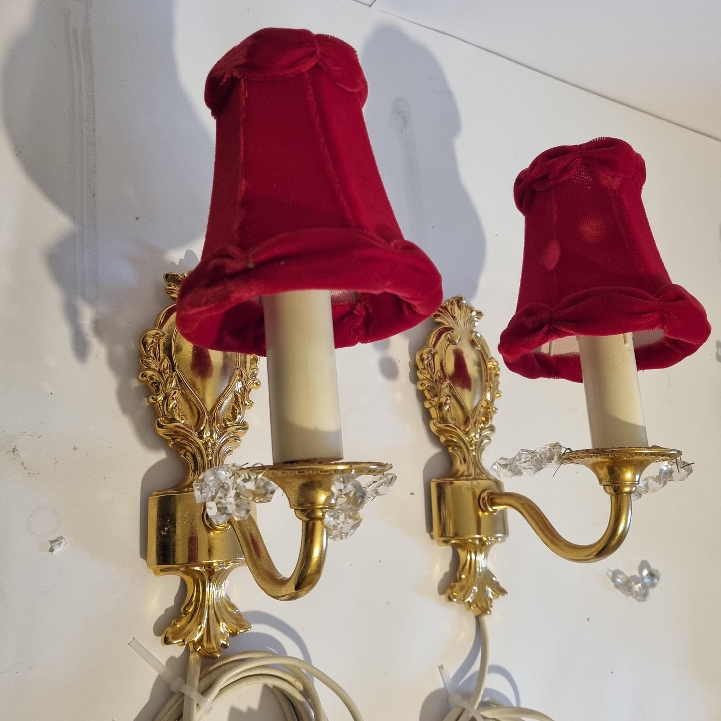 Vintage Rococo style gilded wall lamps pair with original velvet shades in deep red and ornate detailing
