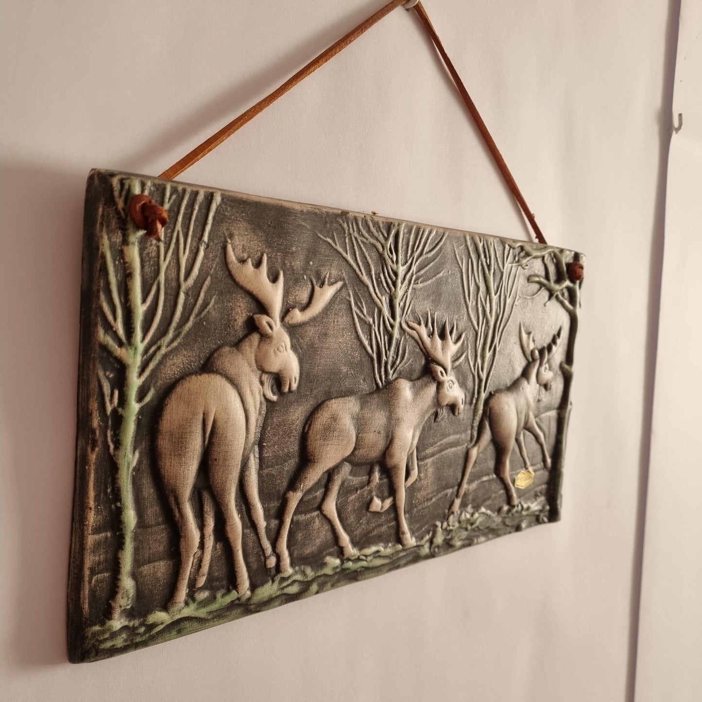 Toreboda Swedish Ceramic Wall Plaque – Moose Forest Relief, Mid-Century showcasing three moose in a textured forest scene hanging on wall
