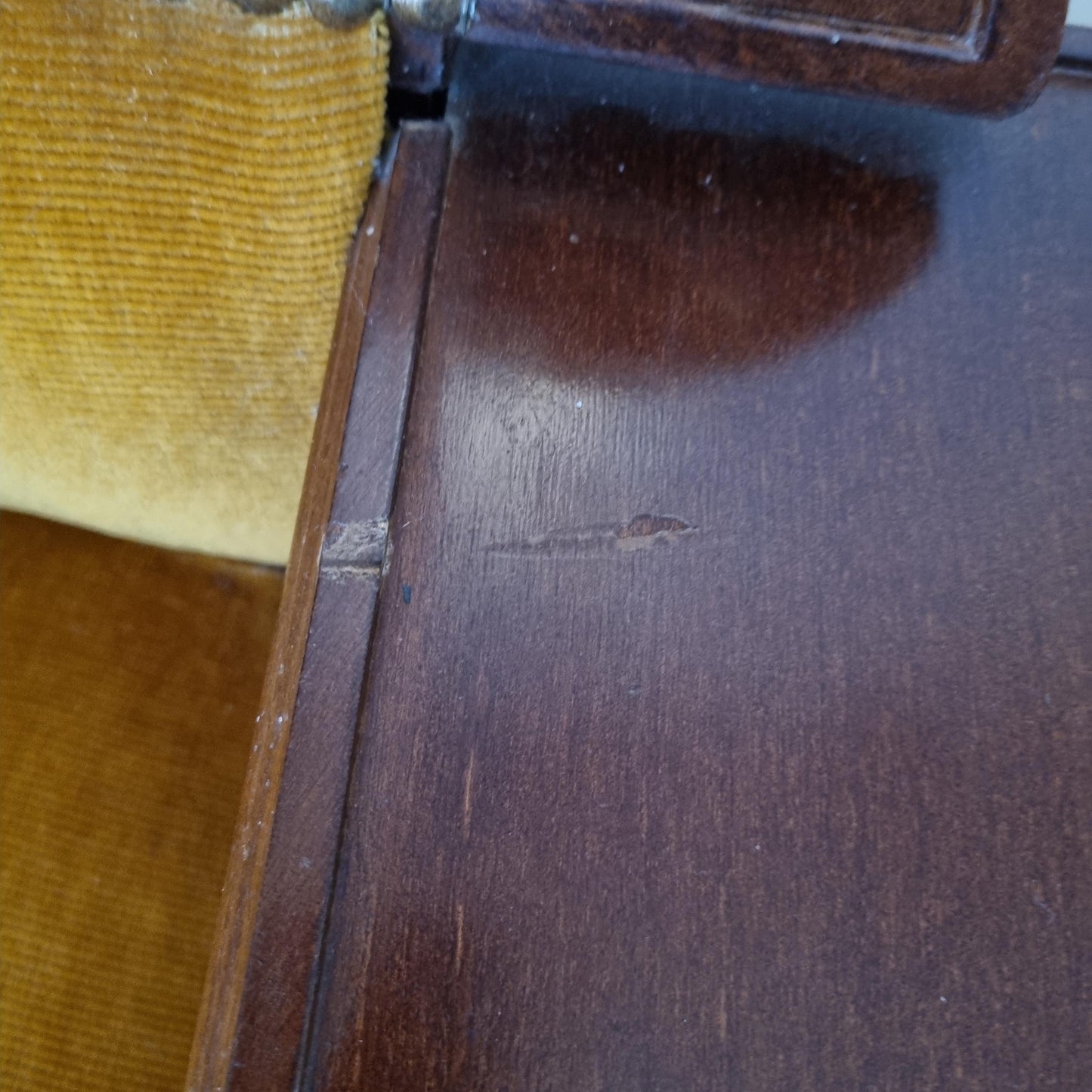 Close-up of worn wood surface and mustard yellow upholstery on Vintage Gossip Bench with Drawer – Elegant Entryway Seat / Vanity Chair-Telefon bench