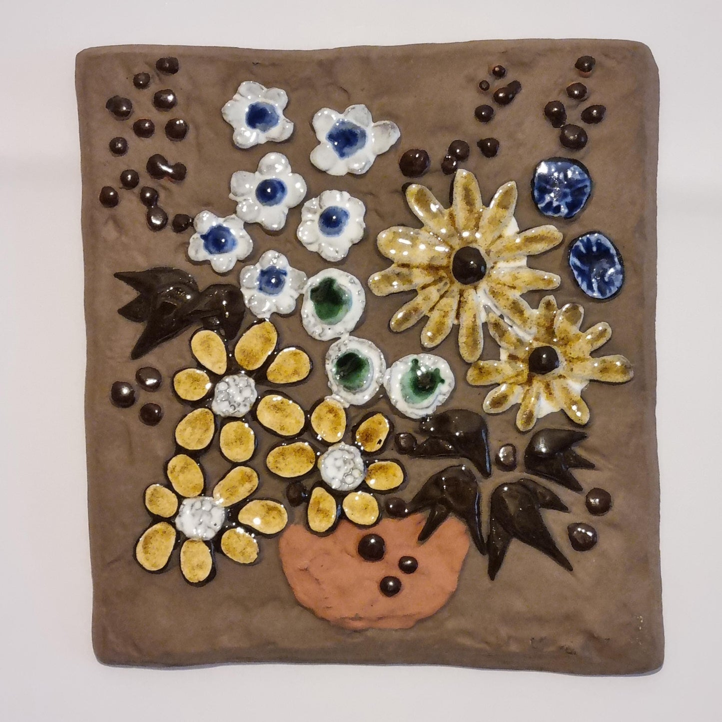 Vintage Swedish Ceramic Wall Plaque – Handcrafted Floral Relief, Signed SWEDEN 759 with colorful flowers on brown background