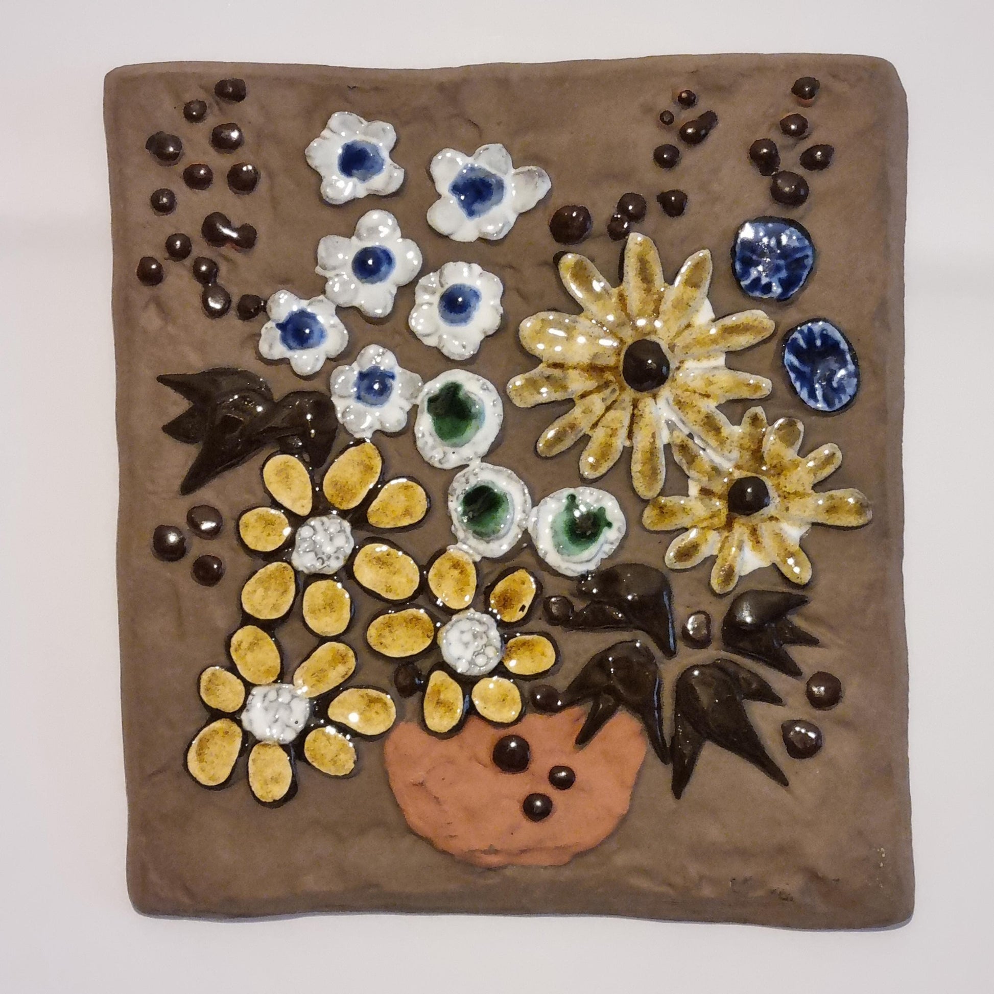 Vintage Swedish Ceramic Wall Plaque – Handcrafted Floral Relief, Signed SWEDEN 759 with colorful flowers on brown background