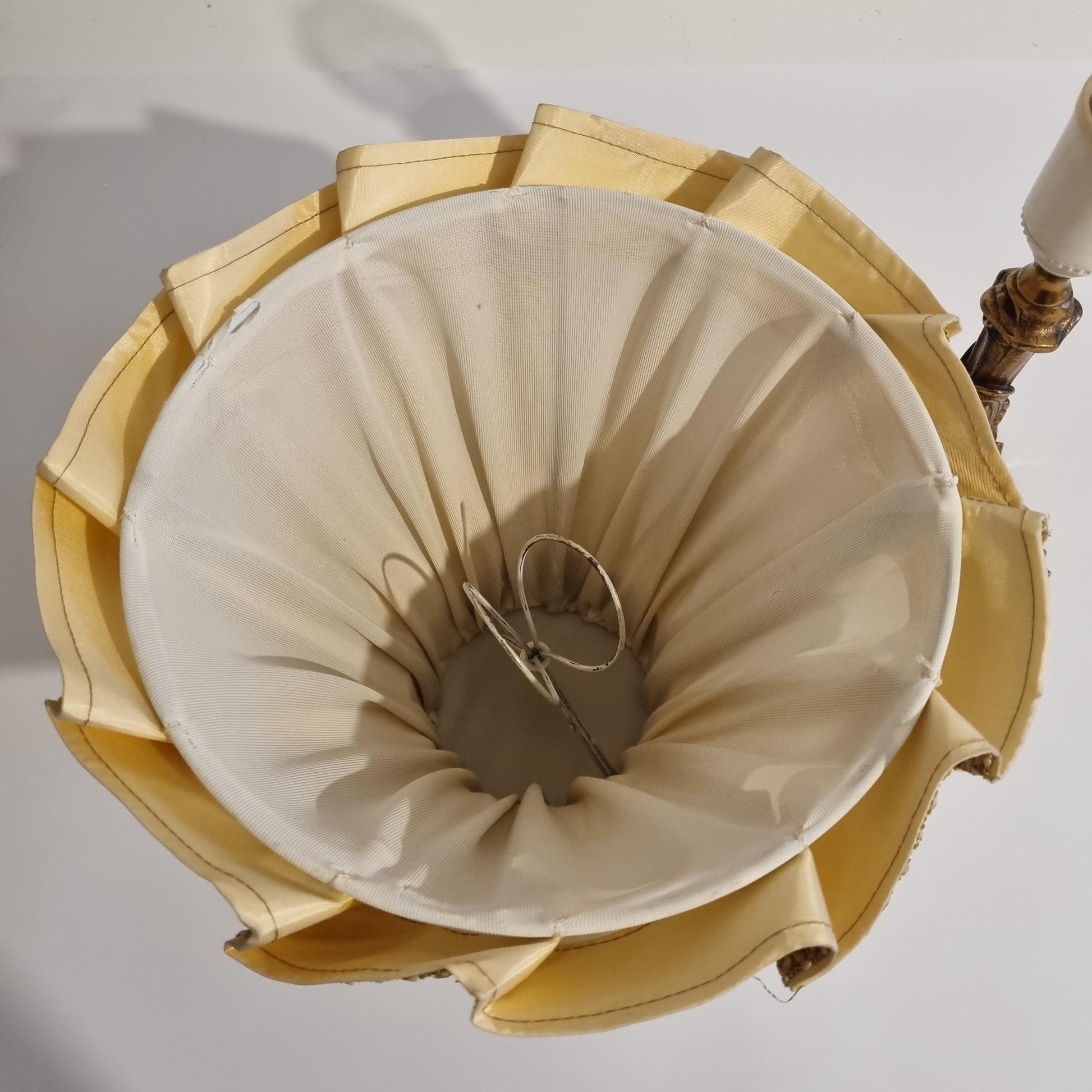 Vintage brass table lamp with pleated shade – ornate baroque style lighting, original piece in warm cream tones viewed from above
