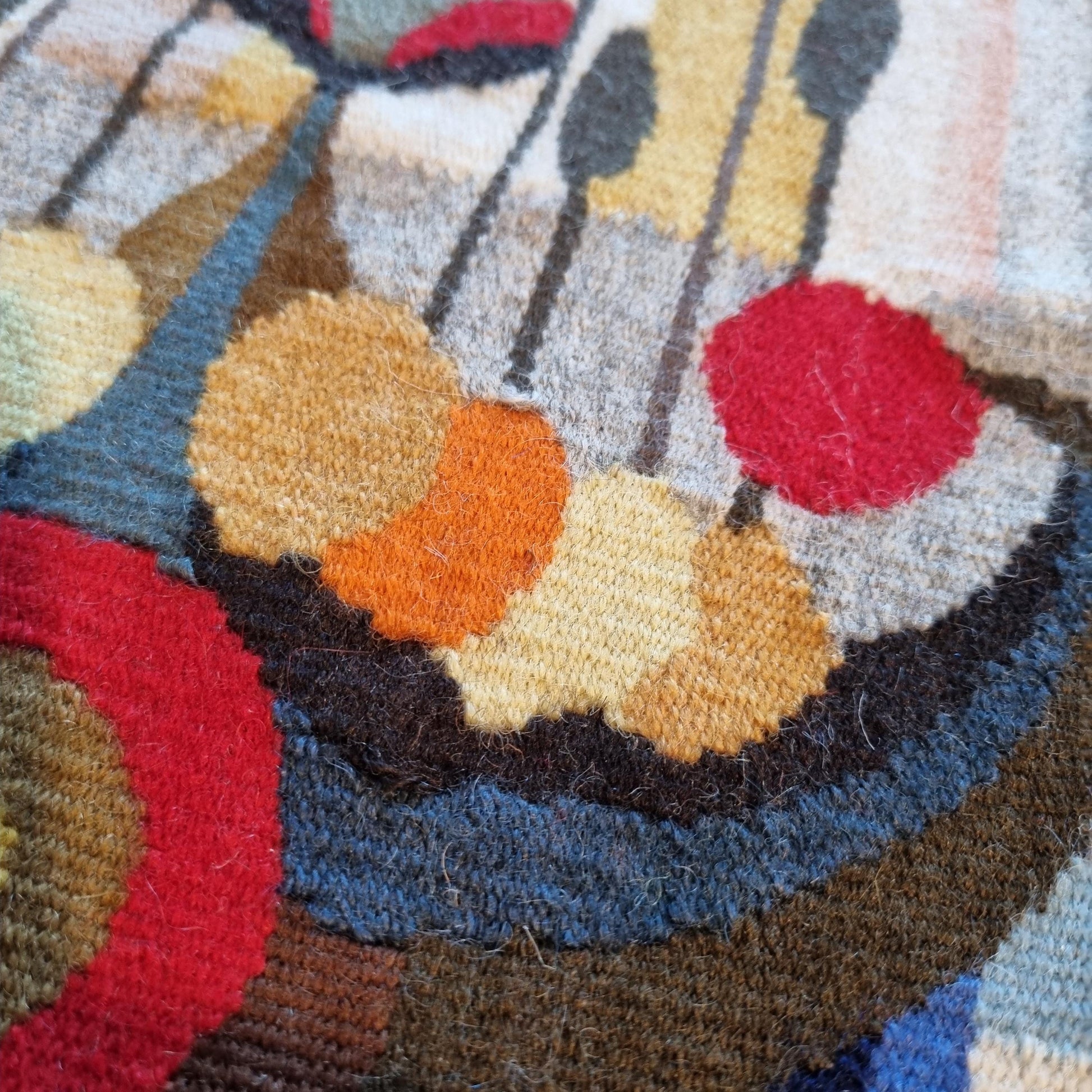 Close-up detail of colorful handwoven yarns on Vintage Viking Ship Tapestry | Mid-Century Modern Woven Wall Art