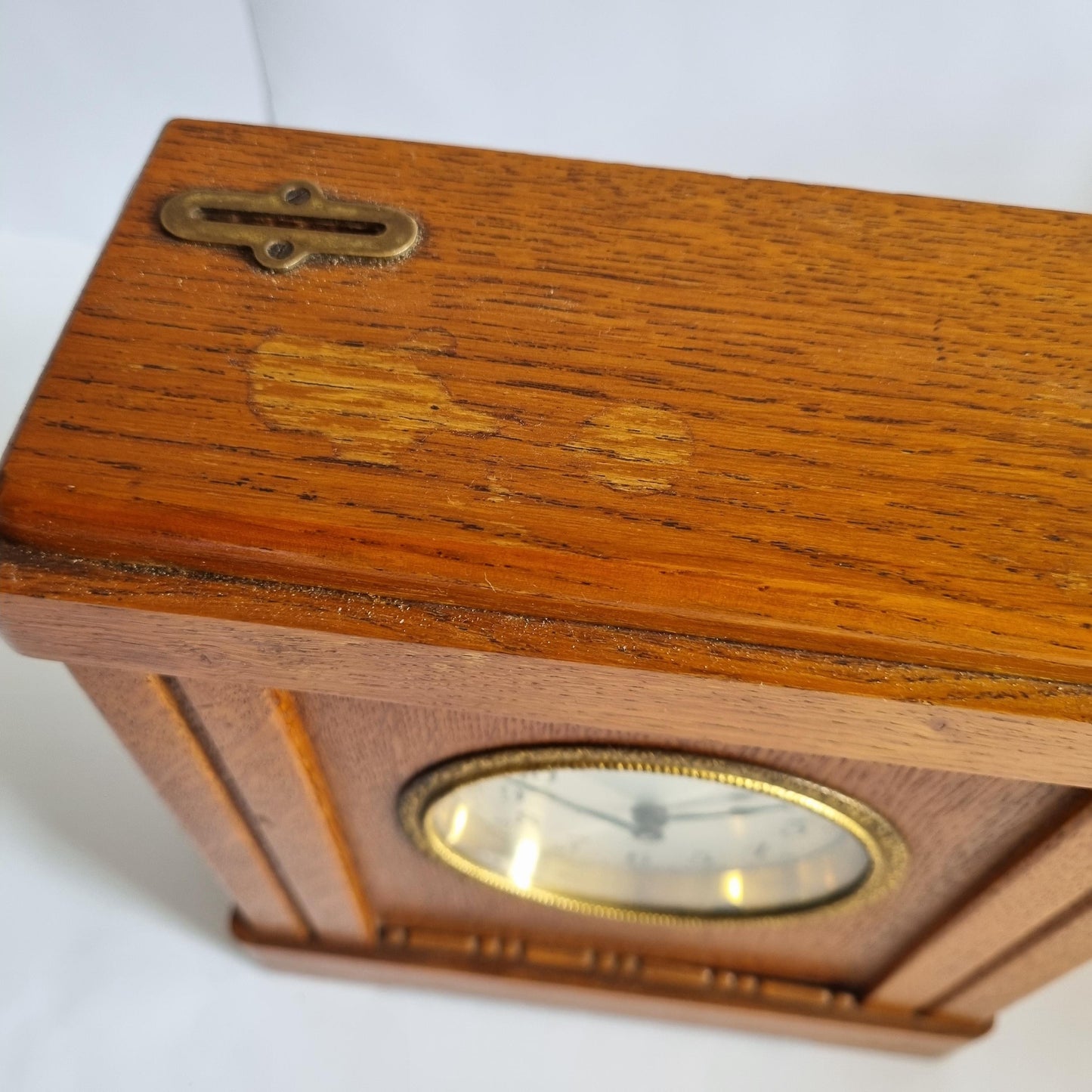 Vintage Oak & Brass Money Box Alarm Clock: 1930s Swedish Bank Collectible (Not Working) showing wood grain and brass latch detail.