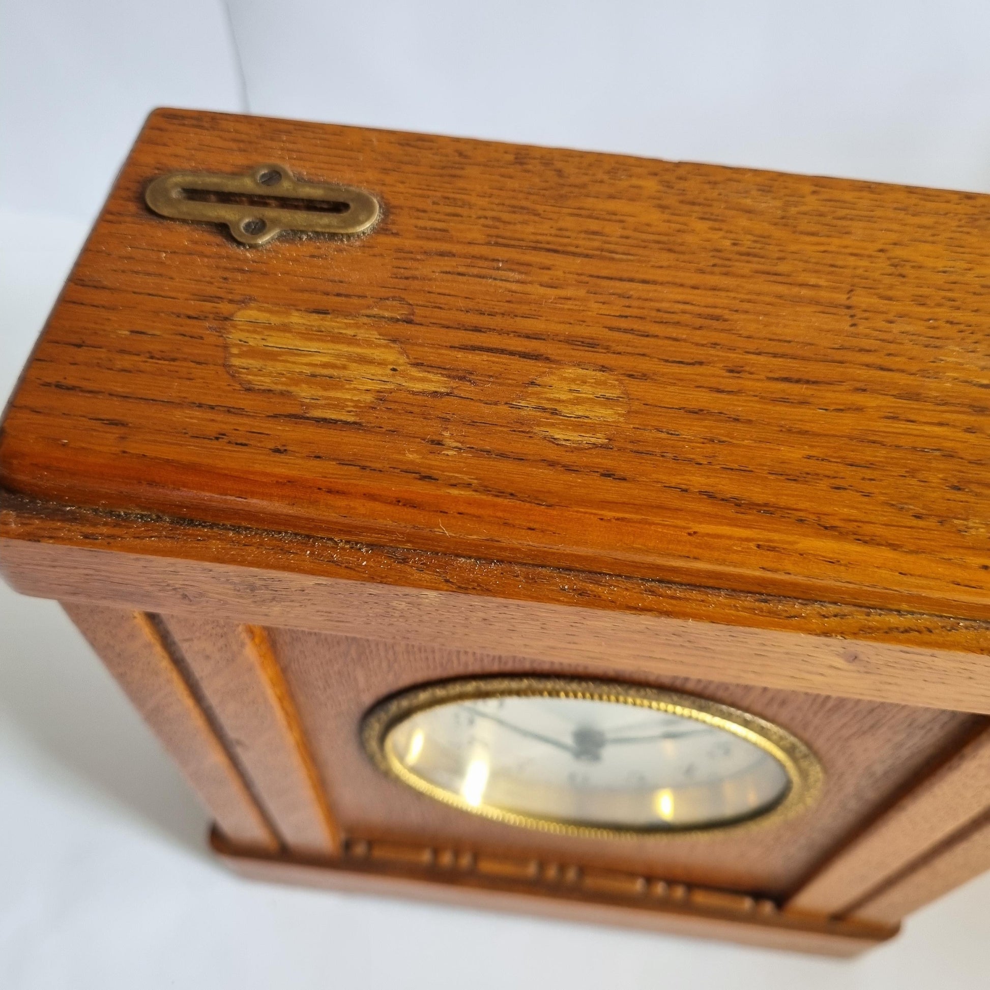 Vintage Oak & Brass Money Box Alarm Clock: 1930s Swedish Bank Collectible (Not Working) showing wood grain and brass latch detail.