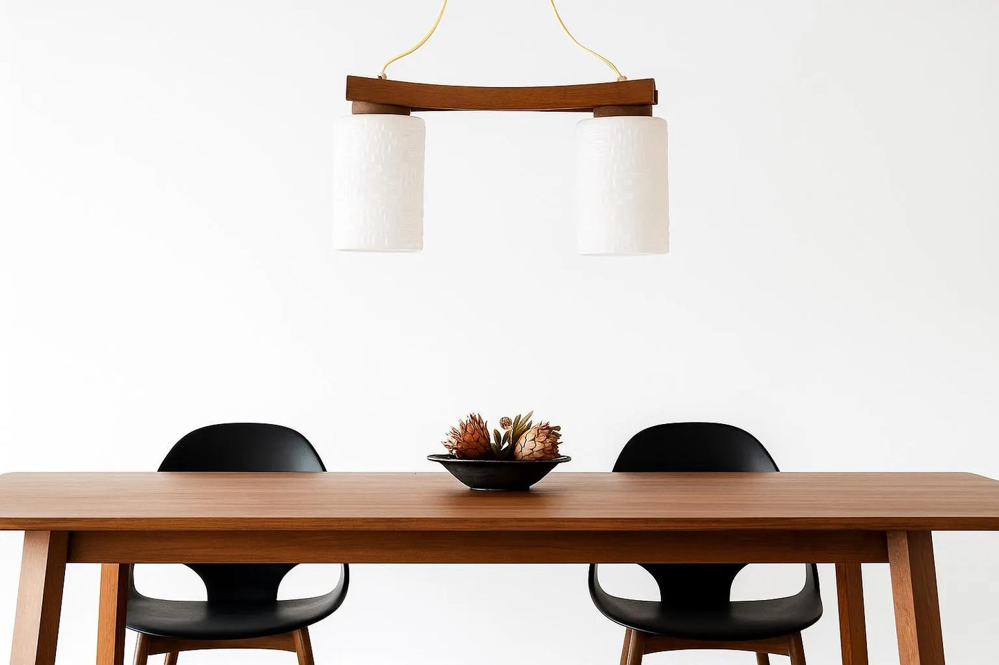 Scandinavian Mid-Century Teak Pendant Lamp – Frosted Glass Shades Chandelier above minimalist teak table with black chairs, timeless charm