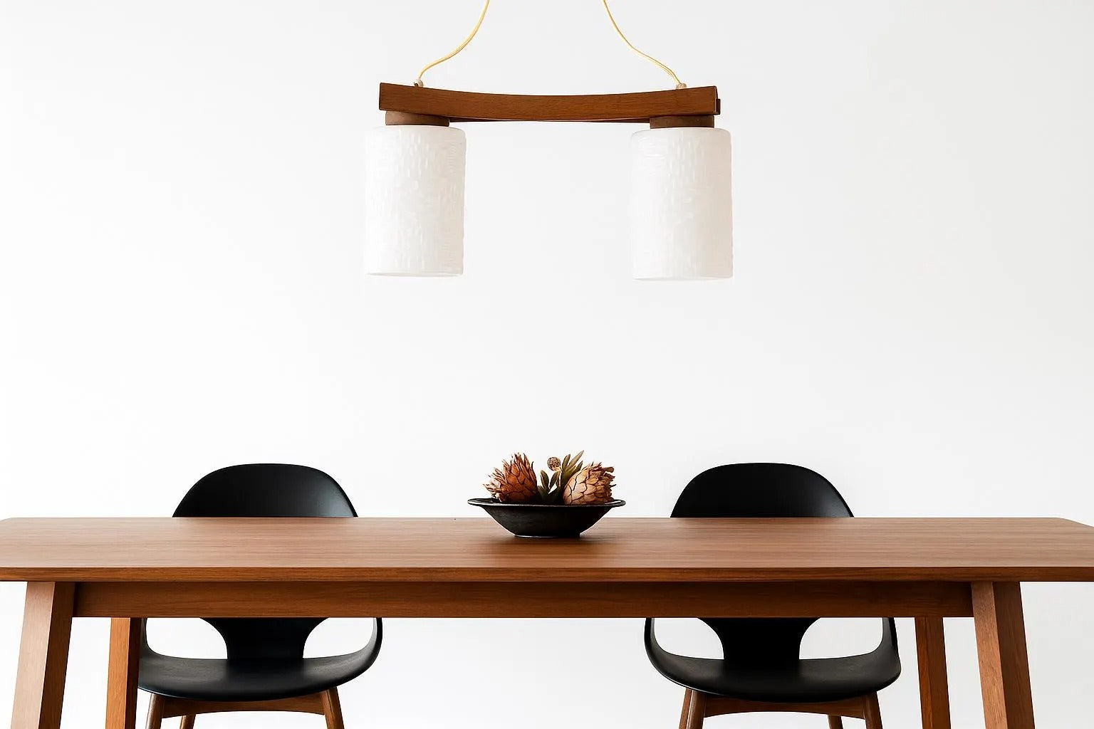 Scandinavian Mid-Century Teak Pendant Lamp – Frosted Glass Shades Chandelier above minimalist teak table with black chairs, timeless charm