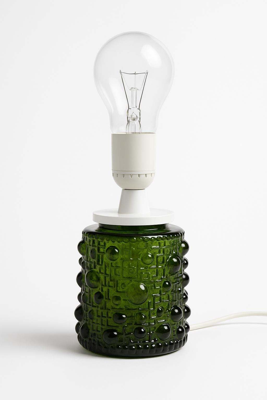 Mid-Century Modern Art Glass Table Lamp – Fåglavik, Sweden, 1970s with green textured glass base and clear bulb.