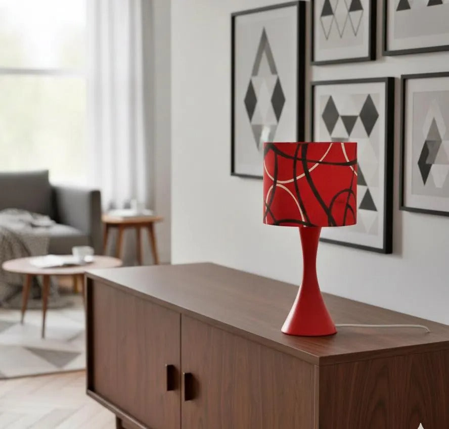 Vintage Marksöjd Red Table Lamp – Iconic Swedish Mid-Century Modern Desk Light, 1970s glowing on wooden sideboard.