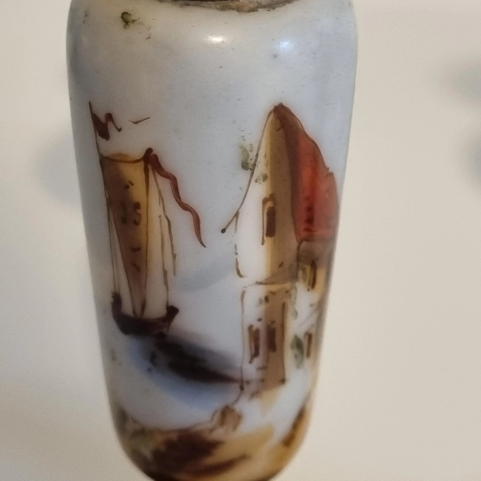 Vintage Brass Candle Holders: Hand-Painted European Village Scene, 1920s Pair with detailed rustic houses and soft color palette.