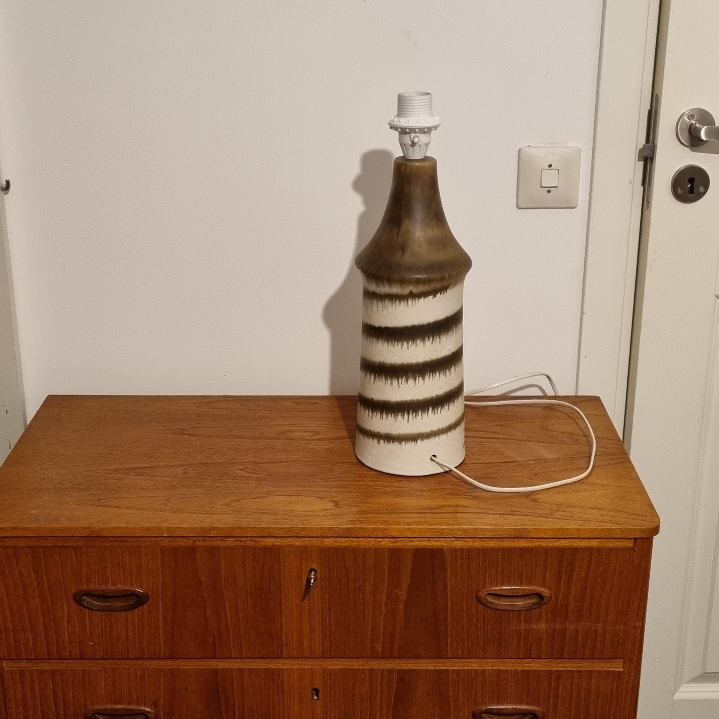 Vintage Scandinavian Ceramic Lamp – EGO Stengods, Bruno Karlsson, Sweden 1960s on wooden mid-century modern dresser, Timeless Charm.