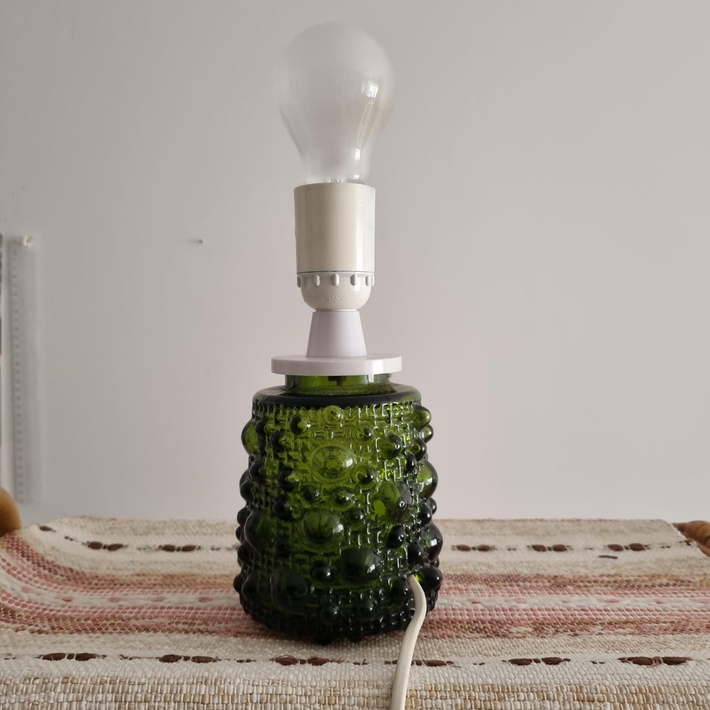 Mid-Century Modern Art Glass Table Lamp – Fåglavik, Sweden, 1970s with green textured base on woven textile surface