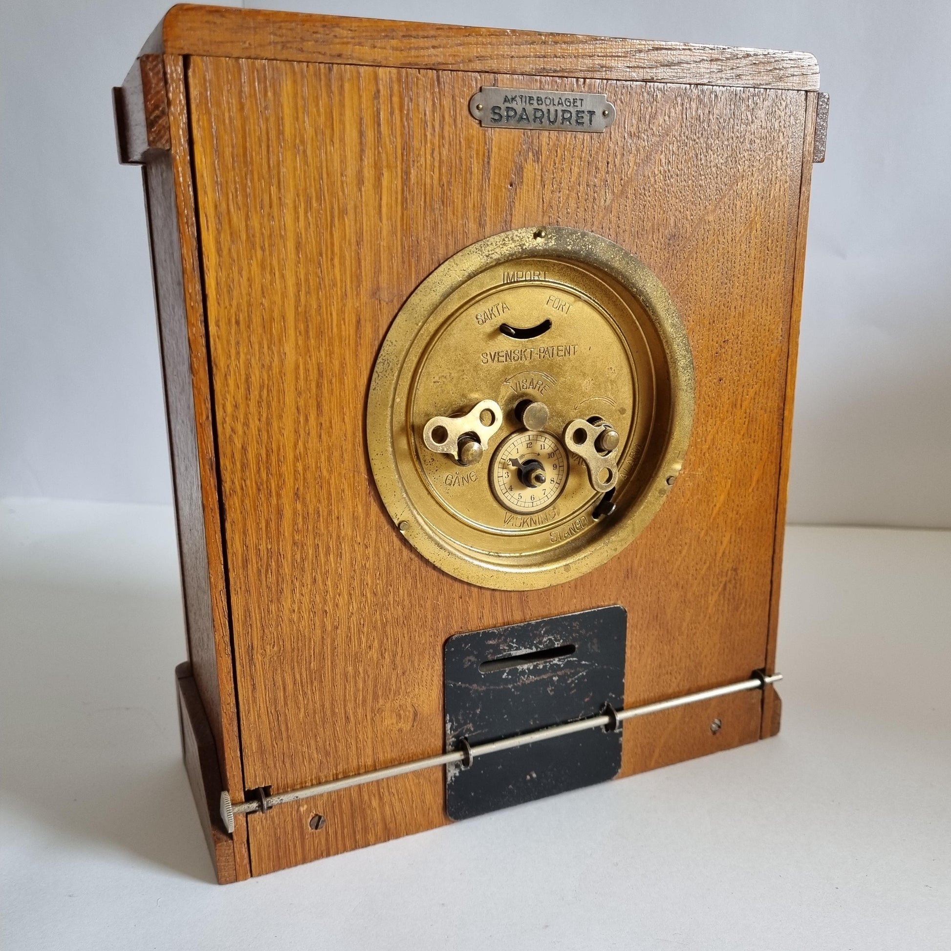 Vintage Oak & Brass Money Box Alarm Clock: 1930s Swedish Bank Collectible (Not Working) in oak wood with brass dial and keyholes
