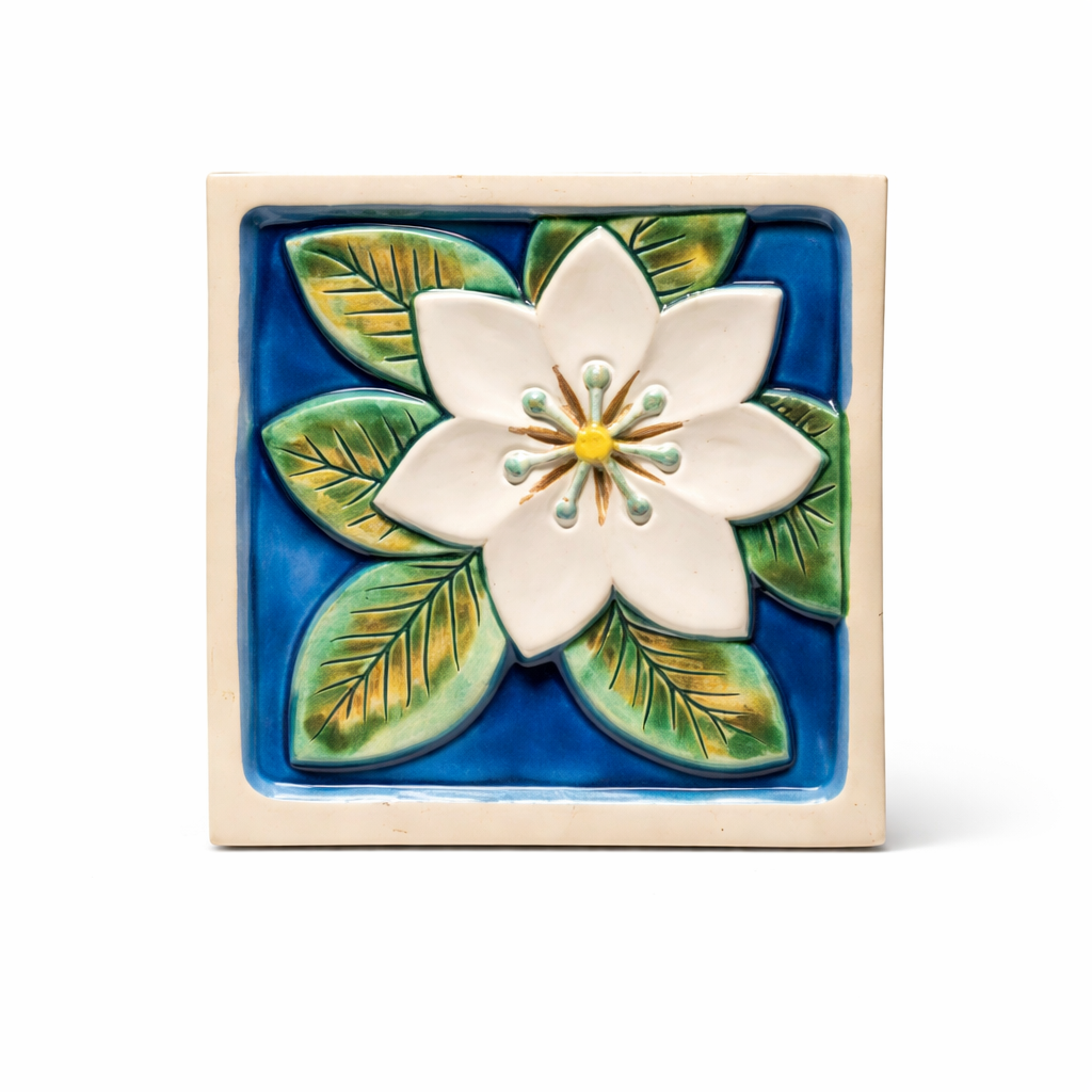 Swedish Ceramic Wall Plaque – Handcrafted Floral Relief, Signed, Mid-Century with white flower and green leaves on blue background